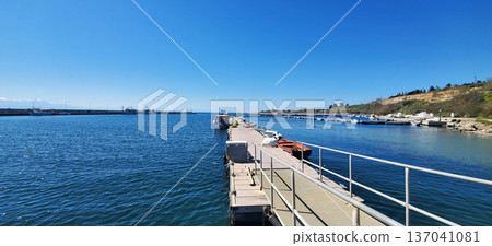 A small seaport on a sunny day. A small seaport on a sunny day. 137041081