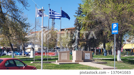 The city's central square with a monument and national flag. The city's central square with a monument and national flag. 137041083