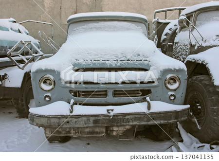 Old car in winter under the snow 137041135