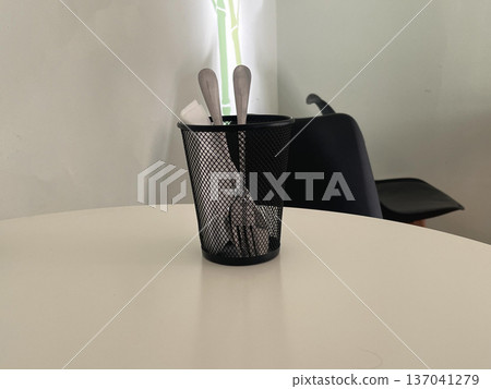 a bucket for cutlery on the table a bucket for cutlery on the table 137041279