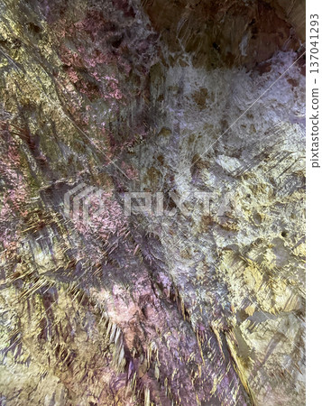 Cave surface with stalactites in colorful light Cave surface with stalactites in colorful light 137041293