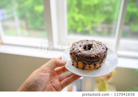 Croissant donut on hand Croissant donut on hand 137041656