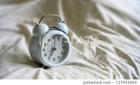 Alarm Clock on Bed 137041669