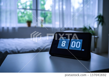 Alarm clock and windowsill Alarm clock and windowsill 137041692