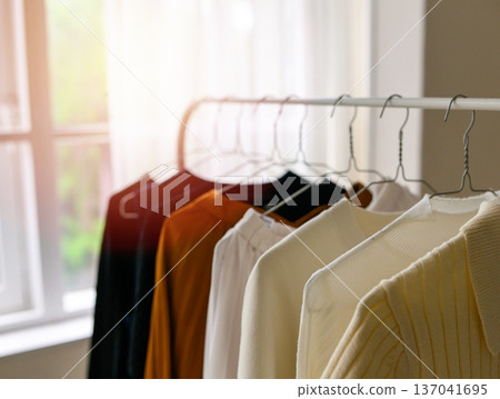 A closet filled with clothes 137041695