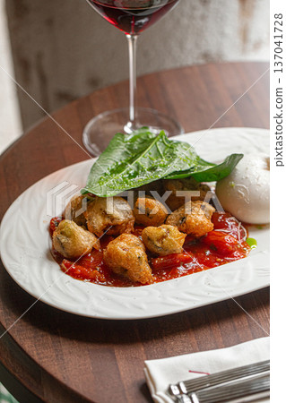 Burrata with roasted chicken and red wine Burrata with roasted chicken and red wine 137041728