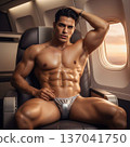 Handsome Male Model in Vibrant Fashion Swimwear Relaxing in Luxury Airline First Class Suite 137041750