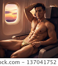 Handsome Male Model in Vibrant Fashion Swimwear Relaxing in Luxury Airline First Class Suite 137041752