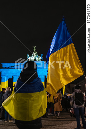 Protester Draped in Ukrainian Flag Faces Brandenburg Gate in Berlin Protester Draped in Ukrainian Flag Faces Brandenburg Gate in Berlin 137041870