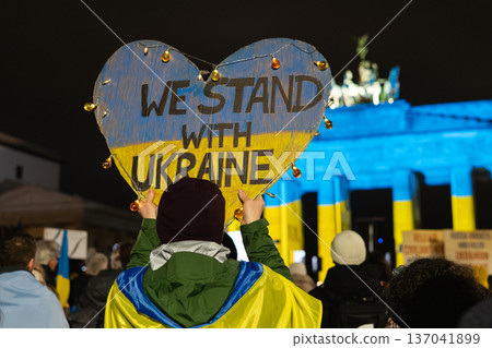 Heart-Shaped We Stand With Ukraine Sign in Front of Brandenburg Gate 137041899