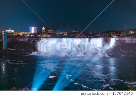 Niagara Falls Night View With Illuminated Waterfall And City Lights Niagara Falls Night View With Illuminated Waterfall And City Lights 137042140