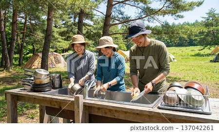 Families, couples, friends and groups enjoying camping 137042261
