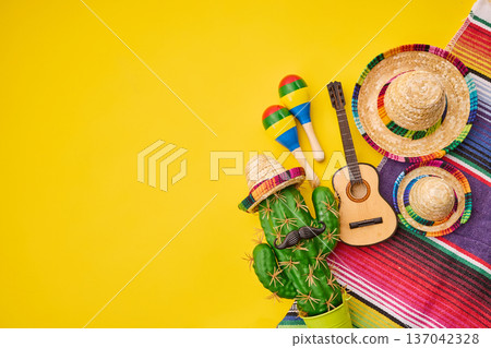 Mexican fiesta decorations with cactus wearing a sombrero 137042328