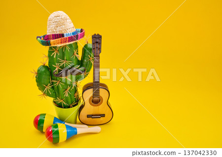 Cactus wearing sombrero and mustache with guitar, maracas on yellow background Cactus wearing sombrero and mustache with guitar, maracas on yellow background 137042330