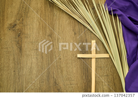 Palm cross, palm fronds, and purple fabric for lent Palm cross, palm fronds, and purple fabric for lent 137042357