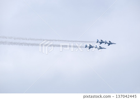 Blue Impulse flying while pulling contrails Blue Impulse flying while pulling contrails 137042445