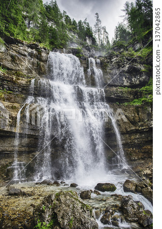 Water cascading down Vallesinella Falls in the Dolomites, Italy 137042865