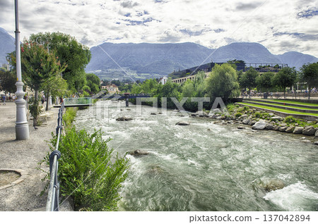 Passirio River flowing through Merano city center, South Tyrol, Italy 137042894