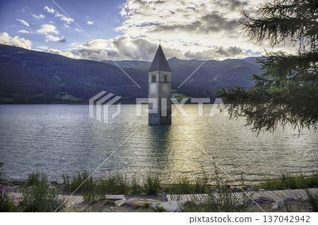 The iconic submerged Church Tower of Graun, Lake Reschensee, Italy 137042942