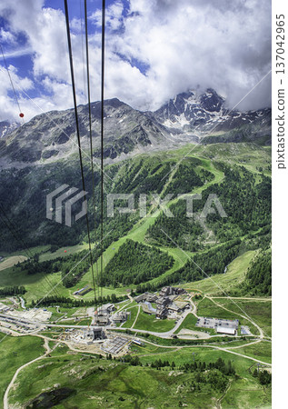 Ascending Schnalstal Glacier by cable car in the Italian Alps 137042965