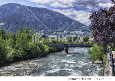 Passirio River flowing through Merano city center, South Tyrol, Italy 137042978
