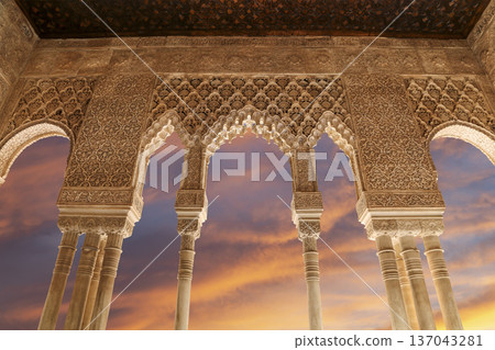 Arches in Islamic (Moorish) style (against the sunset) in Alhambra, Granada, Spain Arches in Islamic (Moorish) style (against the sunset) in Alhambra, Granada, Spain 137043281