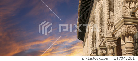 Arches in Islamic (Moorish) style (against the sunset) in Alhambra, Granada, Spain 137043291