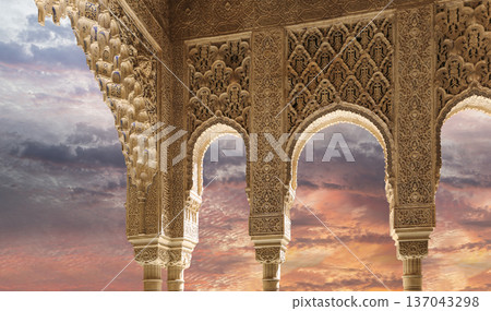 Arches in Islamic (Moorish) style (against the sunset) in Alhambra, Granada, Spain Arches in Islamic (Moorish) style (against the sunset) in Alhambra, Granada, Spain 137043298