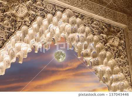 Arches in Islamic (Moorish) style (against the sunset and supermoon) in Alhambra, Granada, Spain Arches in Islamic (Moorish) style (against the sunset and supermoon) in Alhambra, Granada, Spain 137043446