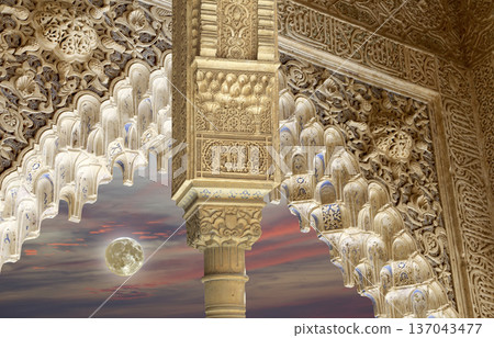 Arches in Islamic (Moorish) style (against the sunset and supermoon) in Alhambra, Granada, Spain Arches in Islamic (Moorish) style (against the sunset and supermoon) in Alhambra, Granada, Spain 137043477