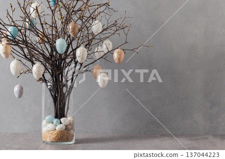 Easter tree with pastel eggs in vase on grey background 137044223