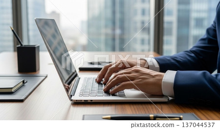 The hands of a business person operating a laptop in the office The hands of a business person operating a laptop in the office 137044537