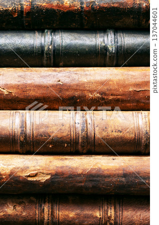 Stack of old books close up. Books in a row or stacked. Vintage or retro books. Stack of old books close up. Books in a row or stacked. Vintage or retro books. 137044601