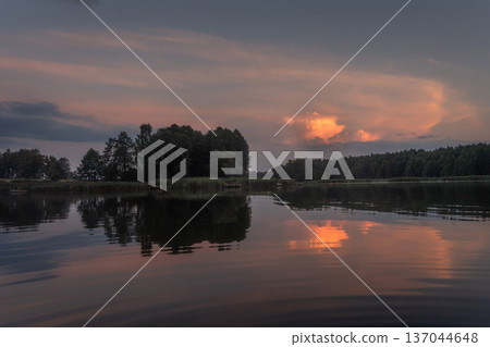 Colourful landscape of nature with lake sky and trees. Beatiful lakeside with reflections of sky in the water Colourful landscape of nature with lake sky and trees. Beatiful lakeside with reflections of sky in the water 137044648