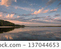 Beautiful landscape of lake at colourful sunset with pink clouds mirror in surface of water reflection 137044653