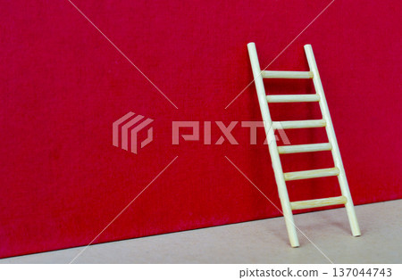 Wooden ladder on bold red background with customizable space for text or ideas, highlighting ambition and breakthrough success concept Wooden ladder on bold red background with customizable space for text or ideas, highlighting ambition and breakthrough success concept 137044743