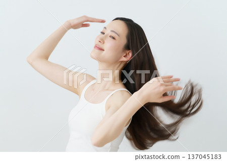 A young Japanese woman with long hair blowing in the wind Beauty A young Japanese woman with long hair blowing in the wind Beauty 137045183