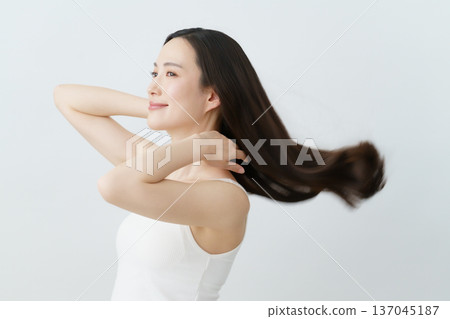 A young Japanese woman with long hair blowing in the wind Beauty A young Japanese woman with long hair blowing in the wind Beauty 137045187