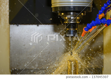 Advanced CNC milling of brass material using oil coolant lubrication and a ball nose end mill for high-precision surface finishing. 137045307
