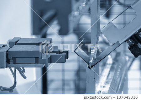 Automated sheet metal forming process using a high-precision 6-axis industrial robot integrated with a CNC hydraulic press brake. Automated sheet metal forming process using a high-precision 6-axis industrial robot integrated with a CNC hydraulic press brake. 137045310
