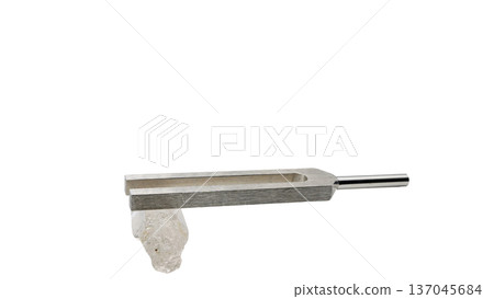 Macro photography of a tuning fork with a crystal and a DNA tuner (transparent background) 137045684