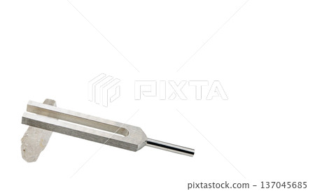 Macro photography of a tuning fork with a crystal and a DNA tuner (transparent background) Macro photography of a tuning fork with a crystal and a DNA tuner (transparent background) 137045685