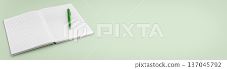 Open squared notebook with green pen on green background 137045792