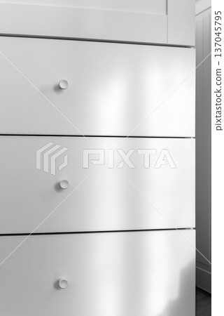Minimal white dresser in modern interior with soft light Minimal white dresser in modern interior with soft light 137045795