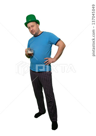 Man wearing green leprechaun hat holding beer glass. Casual pose with hand on hip. St. Patricks Day festive character concept. Humorous Irish holiday celebration and fun tradition illustration. Man wearing green leprechaun hat holding beer glass. Casual pose with hand on hip. St. Patricks Day festive character concept. Humorous Irish holiday celebration and fun tradition illustration. 137045849