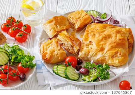 Sliced savory greek meat bougatsa of crispy phyllo pastry Sliced savory greek meat bougatsa of crispy phyllo pastry 137045867