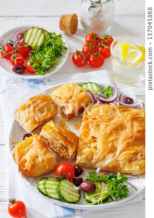 Sliced savory greek meat bougatsa of crispy phyllo pastry Sliced savory greek meat bougatsa of crispy phyllo pastry 137045868