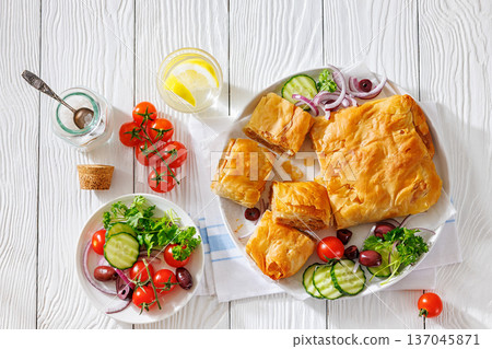 Sliced savory greek meat bougatsa of crispy phyllo pastry 137045871