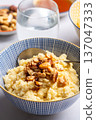Millet porridge with mixed nuts 137047333