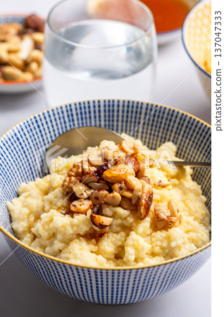 Millet porridge with mixed nuts Millet porridge with mixed nuts 137047333
